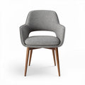 Mid-century modern accent chair with fabric upholstery and wooden legs